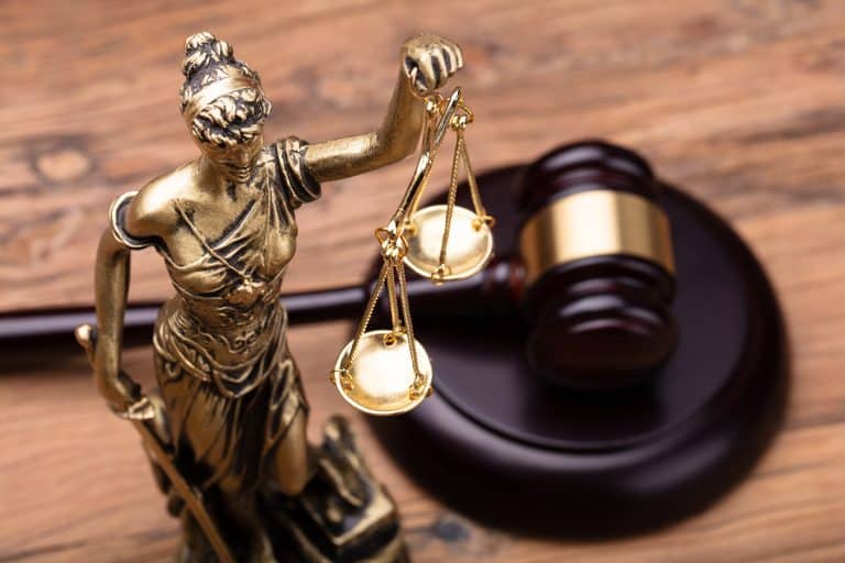 Lady Justice with a court gavel - judgment served